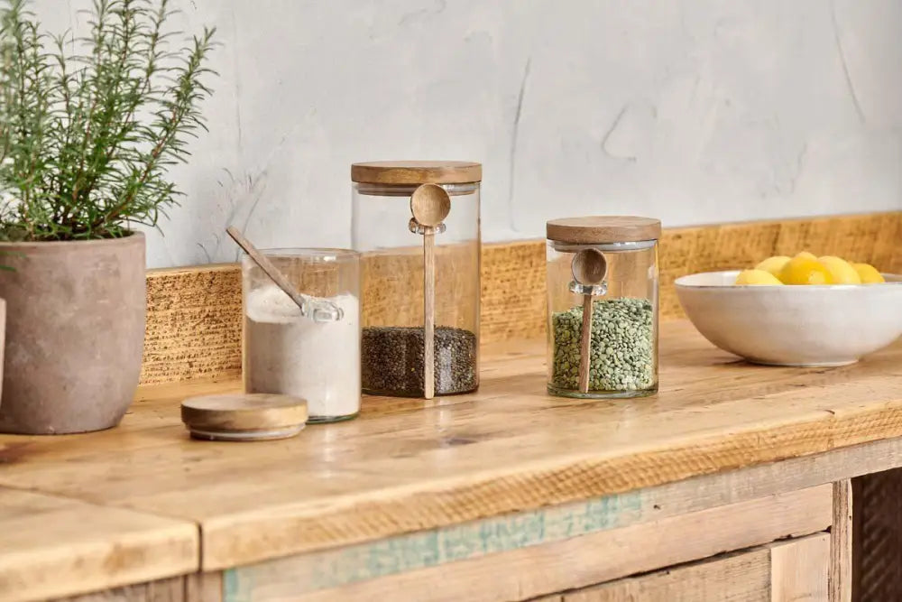 Nkuku Kossi Storage Jar – small recycled glass jar with mango wood lid - Kitchen & Dining